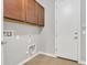 Laundry room featuring upper cabinets and tile flooring at 1258 W Plane Tree Ave, San Tan Valley, AZ 85140