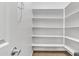Walk-in pantry with multiple shelves for storage and organization to maximize kitchen space at 1258 W Plane Tree Ave, San Tan Valley, AZ 85140