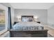 This main bedroom features a large bed with unique bedding and gray walls at 13233 W Mauna Loa Ln, Surprise, AZ 85379