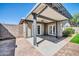 This covered patio boasts ample space for outdoor entertaining and relaxation at 13233 W Mauna Loa Ln, Surprise, AZ 85379