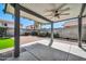 Covered patio offering an excellent view of the well-maintained backyard and neighborhood at 13233 W Mauna Loa Ln, Surprise, AZ 85379