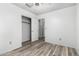 This bedroom features a closet with an open door, plank floors, and a ceiling fan at 1433 E Mineral Rd, Gilbert, AZ 85234