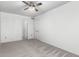 This bedroom offers neutral walls, carpet, and a ceiling fan for comfortable living at 1433 E Mineral Rd, Gilbert, AZ 85234