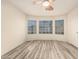 Bright, empty bedroom with hardwood floors and a bay window at 1433 E Mineral Rd, Gilbert, AZ 85234