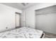 This bedroom offers a closet with clothing rack, large window, and ceiling fan at 1433 E Mineral Rd, Gilbert, AZ 85234
