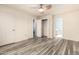 Spacious bedroom with hardwood floors, and connecting bathroom and closet at 1433 E Mineral Rd, Gilbert, AZ 85234