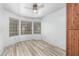 Inviting bedroom with durable gray vinyl plank flooring and lots of natural light at 1433 E Mineral Rd, Gilbert, AZ 85234