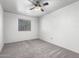Bedroom features neutral carpet, a ceiling fan and a window at 1433 E Mineral Rd, Gilbert, AZ 85234
