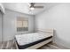 This bedroom features a large window for lots of natural light, and a mattress with modern light frame at 1433 E Mineral Rd, Gilbert, AZ 85234