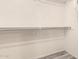 Walk-in closet with clothing racks, offers ample storage space at 1433 E Mineral Rd, Gilbert, AZ 85234