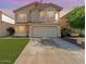 Charming two-story home with desert landscaping, arched windows, and a two-car garage at 1433 E Mineral Rd, Gilbert, AZ 85234