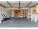 This garage has built in shelving, dartboard, lawn mower, and ample space at 1433 E Mineral Rd, Gilbert, AZ 85234