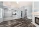 Spacious living room features seamless flow to kitchen area, fireplace and vinyl floors at 1433 E Mineral Rd, Gilbert, AZ 85234
