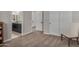 Neutral bedroom featuring adjacent dual vanity bathroom and two double closets at 14571 W Wethersfield Rd, Surprise, AZ 85379