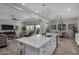 Open-concept kitchen seamlessly connects to the living and dining areas, offering a modern and spacious layout at 14571 W Wethersfield Rd, Surprise, AZ 85379