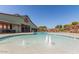 Large pool with fountains offers a refreshing retreat for residents to relax and enjoy the outdoors at 14571 W Wethersfield Rd, Surprise, AZ 85379