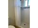 Tiled bathroom with a shower and blue accent tiles at 1532 W 6Th St, Tempe, AZ 85281