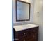 Bathroom vanity with a marble countertop and dark wood cabinets at 1532 W 6Th St, Tempe, AZ 85281