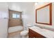 Well-lit bathroom featuring a vanity, toilet, bathtub, and a tiled shower and floor at 1532 W 6Th St, Tempe, AZ 85281
