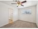 Neutral bedroom with ceiling fan, carpeted floor, and an attached bathroom at 1532 W 6Th St, Tempe, AZ 85281