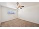 Carpeted bedroom featuring natural light and ceiling fan at 1532 W 6Th St, Tempe, AZ 85281
