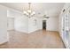 Bright and open dining room with tile floors and a chandelier, perfect for entertaining guests at 1532 W 6Th St, Tempe, AZ 85281