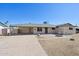 Charming single-story home featuring desert landscaping, a covered parking area, and a welcoming front patio at 1532 W 6Th St, Tempe, AZ 85281