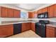 This spacious kitchen features wood cabinets, granite counters, and modern appliances at 1532 W 6Th St, Tempe, AZ 85281