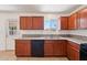Traditional-style kitchen with wood cabinets, granite counters, and appliances, creating a functional cooking space at 1532 W 6Th St, Tempe, AZ 85281
