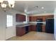 Well-lit kitchen featuring ample cabinet space and modern black appliances at 1532 W 6Th St, Tempe, AZ 85281