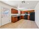 Well-equipped kitchen featuring wood cabinets, black appliances, and tile flooring at 1532 W 6Th St, Tempe, AZ 85281