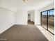 Bright room features neutral carpet and large windows offering lots of natural light at 15650 N 19Th Ave # 1206, Phoenix, AZ 85023