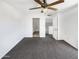 Bright, empty bedroom with carpet flooring and a ceiling fan at 15650 N 19Th Ave # 1206, Phoenix, AZ 85023
