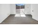 A bright bedroom features carpeted floors and a sliding glass door to the backyard at 15650 N 19Th Ave # 1206, Phoenix, AZ 85023