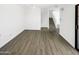 Open-concept living area with stairs, ceiling fan, and vinyl flooring at 15650 N 19Th Ave # 1206, Phoenix, AZ 85023