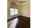 Bright bedroom featuring hardwood floors, a ceiling fan, and lots of natural light at 1633 E Lakeside Dr # 154, Gilbert, AZ 85234