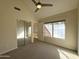 Bedroom with large window, mirrored closet doors, and ensuite bathroom at 1633 E Lakeside Dr # 154, Gilbert, AZ 85234