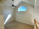 Bedroom with carpet flooring, vaulted ceiling, and a unique triangle window at 1633 E Lakeside Dr # 154, Gilbert, AZ 85234