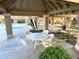 Community outdoor dining pavilion with tables and chairs are adjacent to the refreshing pool at 1633 E Lakeside Dr # 154, Gilbert, AZ 85234