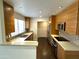 Contemporary kitchen with custom cabinetry, stainless steel appliances, and bar seating at 1633 E Lakeside Dr # 154, Gilbert, AZ 85234