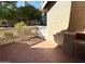 Enclosed patio with stone floors and a built in outdoor grill area, great for entertaining at 1633 E Lakeside Dr # 154, Gilbert, AZ 85234