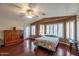 A spacious bedroom featuring hardwood floors and multiple windows for natural light at 16461 W Central St, Surprise, AZ 85388