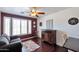 Home office with hardwood floors, natural light, and a ceiling fan at 16461 W Central St, Surprise, AZ 85388