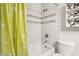 Bathroom features a tiled shower and a toilet with neutral-colored walls at 1649 W Royal Palm Rd, Phoenix, AZ 85021