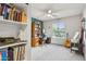 Bedroom features a desk, a bookshelf, and a window with natural light at 1649 W Royal Palm Rd, Phoenix, AZ 85021
