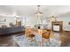 Dining area opens to the living room and kitchen, showcasing the open floor plan at 1649 W Royal Palm Rd, Phoenix, AZ 85021