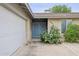 Exterior of home showcasing the front door, garage, and desert landscaping at 1649 W Royal Palm Rd, Phoenix, AZ 85021