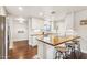 Modern kitchen with white cabinets, butcher block counters, stainless steel appliances and breakfast bar at 1649 W Royal Palm Rd, Phoenix, AZ 85021