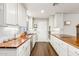 Clean, bright kitchen boasts white cabinets, butcher block counters, and stainless-steel appliances at 1649 W Royal Palm Rd, Phoenix, AZ 85021