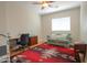 Functional bedroom with a desk, sofa and decorative rug at 1761 N Hester Trl, Casa Grande, AZ 85122